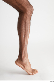 Tiago  1 calf flexing nude side view 0005.jpg